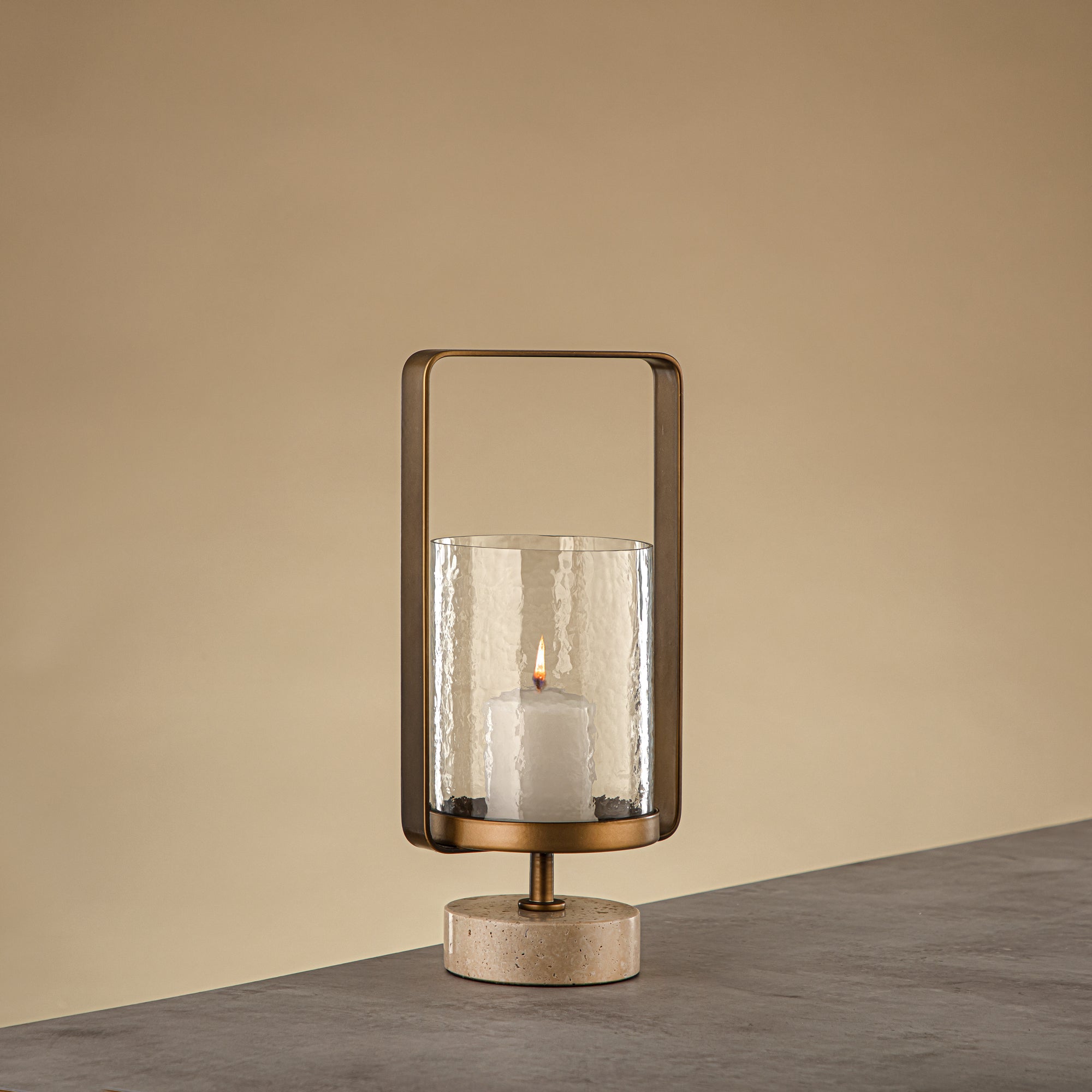 Almarjan Kalon Hurricane Lantern Hammered Clear Glass 15.5x12.5x32.5 CM Brushed Gold & Travertine Base (GMT2960025)