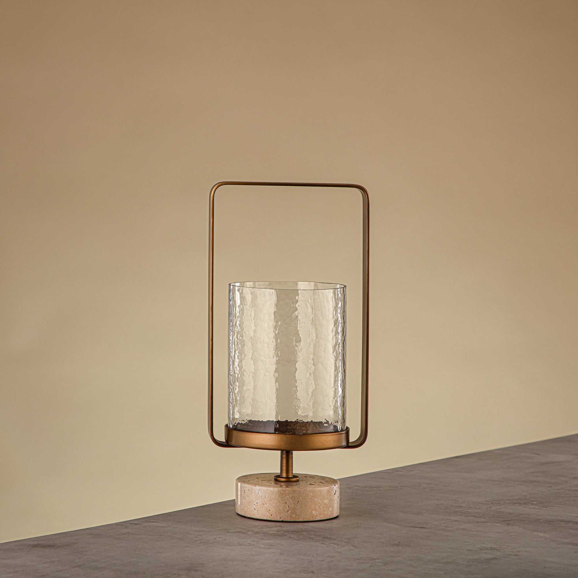 Almarjan Kalon Hurricane Lantern Hammered Clear Glass 15.5x12.5x32.5 CM Brushed Gold & Travertine Base (GMT2960025)